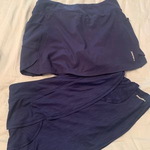 2 EUC navy tennis skirts size large